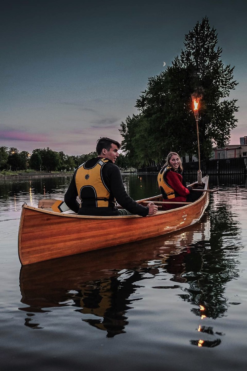 Couple in a cedar canoe in the evening