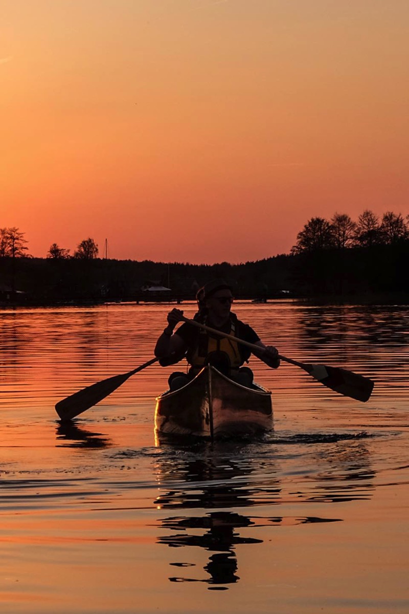 Sunset over lake Glave in Trakai, Lithuania during canoe tour